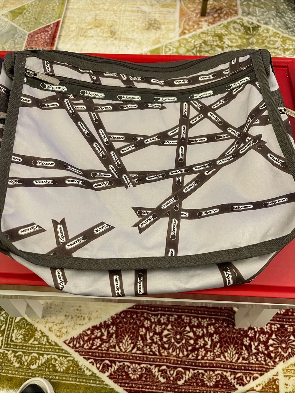 Lesportsac White and Brown Patterned Messenger Bag